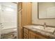Bathroom with granite countertops, hardwood cabinets, sink, toilet, and shower at 100 Cottonwood Ct, Kenly, NC 27542