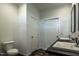 Bathroom featuring a toilet and double vanity, and a door to another room at 100 Cottonwood Ct, Kenly, NC 27542