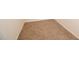 Empty bedroom featuring tan carpet at 100 Cottonwood Ct, Kenly, NC 27542
