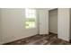 Empty bedroom featuring a closet and a window with a backyard view at 100 Cottonwood Ct, Kenly, NC 27542