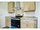 Modern kitchen featuring stainless steel appliances and ample cabinet space at 100 Cottonwood Ct, Kenly, NC 27542