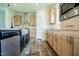 Well-lit kitchen featuring stainless steel appliances, wood cabinets and granite countertops at 100 Cottonwood Ct, Kenly, NC 27542