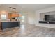 Open concept kitchen and living room with hardwood floors and recessed lighting at 100 Cottonwood Ct, Kenly, NC 27542