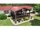 High angle shot of the well-kept lawn and mature plantings of this home with covered porch at 1007 Windward Hill Ct, Middlesex, NC 27557