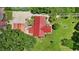 Aerial view of property featuring paddocks for horses and other livestock as well as shelters from the elements at 1007 Windward Hill Ct, Middlesex, NC 27557