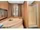 Bathroom featuring a large soaking tub, and separate shower stall with glass door at 1007 Windward Hill Ct, Middlesex, NC 27557