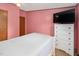 Bedroom with TV and white dresser with flower accents at 1007 Windward Hill Ct, Middlesex, NC 27557