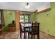Inviting dining room featuring wood-look floors, a classic chandelier, and sliding door access to the outside at 1007 Windward Hill Ct, Middlesex, NC 27557