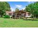 Charming single-story home featuring a covered front porch and well-manicured lawn with tasteful landscaping at 1007 Windward Hill Ct, Middlesex, NC 27557