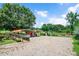 View of the yard showing car ports, and a horse paddock to the right at 1007 Windward Hill Ct, Middlesex, NC 27557