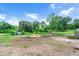 Large paddock with hay bale for feeding horses and a shelter from the elements, providing comprehensive amenities at 1007 Windward Hill Ct, Middlesex, NC 27557