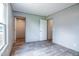 Spacious bedroom with wood-look flooring, neutral walls, and natural light at 101 Cottonwood Ct, Kenly, NC 27542