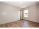 Comfortable bedroom features wood-look flooring, neutral walls, and natural light at 101 Cottonwood Ct, Kenly, NC 27542
