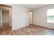 Comfortable bedroom features wood-look flooring, neutral walls, and natural light at 101 Cottonwood Ct, Kenly, NC 27542