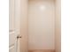 Spacious closet with light neutral paneling and a wooden floor, adjacent to a door at 101 Cottonwood Ct, Kenly, NC 27542