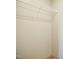 Neutral colored closet with a white wire shelf and wooden floor at 101 Cottonwood Ct, Kenly, NC 27542