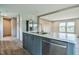 Open kitchen with island, stainless steel appliances, and modern countertops at 101 Cottonwood Ct, Kenly, NC 27542