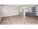 Bright, airy living area with modern flooring, seamlessly transitioning to the kitchen at 101 Cottonwood Ct, Kenly, NC 27542