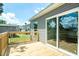 A new wooden backyard deck featuring an outdoor sliding glass door at 103 Cottonwood Ct, Kenly, NC 27542
