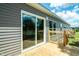A new wooden backyard deck and outdoor sliding glass door at 103 Cottonwood Ct, Kenly, NC 27542