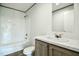 A bathroom that includes a shower-tub combination and a white vanity at 103 Cottonwood Ct, Kenly, NC 27542