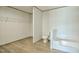 Bathroom area includes a shower/tub with storage shelving in the background at 103 Cottonwood Ct, Kenly, NC 27542