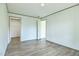 A new, empty bedroom with an open closet area and light-colored flooring at 103 Cottonwood Ct, Kenly, NC 27542