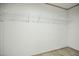 Inside an empty closet with wire shelving and light-colored flooring at 103 Cottonwood Ct, Kenly, NC 27542