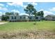 Bright and sunny home featuring a well maintained lawn, and light gray exterior at 103 Cottonwood Ct, Kenly, NC 27542