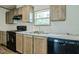 Bright kitchen featuring stainless steel appliances and light-colored wood cabinets at 103 Cottonwood Ct, Kenly, NC 27542