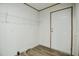 This laundry room has a wire shelf and a white door at 103 Cottonwood Ct, Kenly, NC 27542