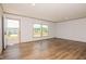 Spacious living room with hardwood floors, natural light, and neutral paint at 103 Cottonwood Ct, Kenly, NC 27542