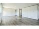 A neutral space, bright living room with new, light-colored flooring and recessed lighting at 103 Cottonwood Ct, Kenly, NC 27542