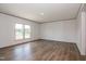 Inviting living room with lots of light, neutral paint and wood-look flooring at 103 Cottonwood Ct, Kenly, NC 27542