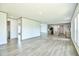 Bright, open-concept living area with modern light-colored flooring and abundant natural light at 103 Cottonwood Ct, Kenly, NC 27542