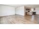 Open living room with hardwood floors and an open-concept kitchen area at 103 Cottonwood Ct, Kenly, NC 27542
