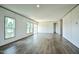Expansive living room with lots of windows and wood look flooring at 103 Cottonwood Ct, Kenly, NC 27542