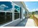A concrete side porch of a long gray home with many windows at 103 Cottonwood Ct, Kenly, NC 27542