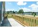 A wooden side porch featuring a great view of the neighborhood at 103 Cottonwood Ct, Kenly, NC 27542