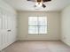 Cozy bedroom features neutral paint, window, carpet and a double-door closet at 106 Dodge Ln, Smithfield, NC 27577