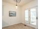 Bright dining area with a modern pendant light fixture, and access to a patio at 106 Dodge Ln, Smithfield, NC 27577
