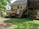 Exterior view of the home showcasing the deck and surrounding backyard at 106 Dodge Ln, Smithfield, NC 27577