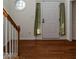 Spacious foyer with hardwood floors featuring staircase, front door and octagon window at 106 Dodge Ln, Smithfield, NC 27577