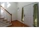 Bright foyer with hardwood floors, staircase, and a front door with natural light and hardwood flooring at 106 Dodge Ln, Smithfield, NC 27577