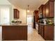 Kitchen with a breakfast bar, dark wood cabinets, and stainless steel appliances at 106 Dodge Ln, Smithfield, NC 27577