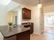 Kitchen with breakfast bar, double sinks, tiled floor, and access to another room at 106 Dodge Ln, Smithfield, NC 27577