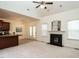 Open-concept living room with a fireplace flowing into the kitchen and back door to the deck at 106 Dodge Ln, Smithfield, NC 27577