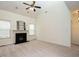 Bright living room featuring fireplace, neutral carpet, and windows that let in plenty of natural light at 106 Dodge Ln, Smithfield, NC 27577