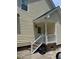 Back entrance with porch and stairs featuring a door, vinyl siding, and an outdoor wall light at 1109 Beechwood Dr, Rocky Mount, NC 27803