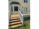 Spacious backyard deck with stairs providing outdoor living with adjacent bay window and sliding glass doors at 1109 Beechwood Dr, Rocky Mount, NC 27803